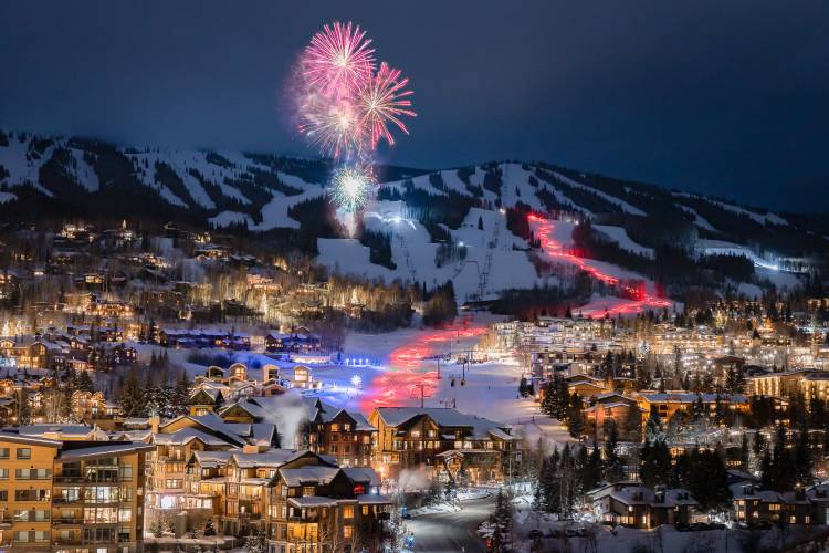 Local skiers with torchlights skiing Fanny Hill on Snowmass Mountain on New Years Eave Local skiers with torchlights skiing Fanny Hill on Snowmass Mountain on New Years Eave